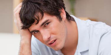 Man feeing sad after his teen brother called him a loser