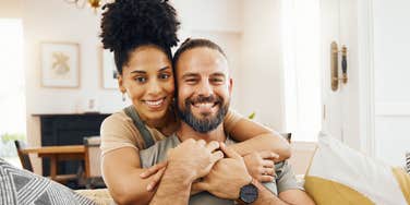 happy peaceful couple smiling holding each other