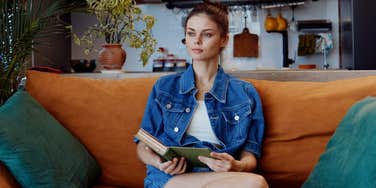 woman sitting in her living room blocking financial blessings