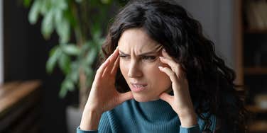 Woman dealing with tiny annoyances that feel like a personal attack