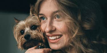 Woman treats pet like royalty.