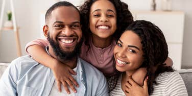 happy couple with no disposable income making childhood special for their daughter