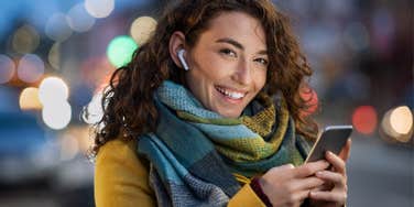 Woman happily using ChatGPT and trusting it completely