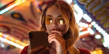 Woman uses phone.