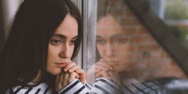 sad woman after facing narcissistic shame