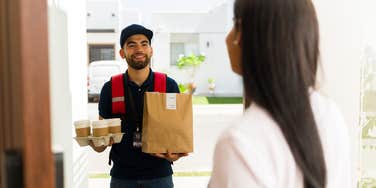DoorDash driver delivering food to a woman
