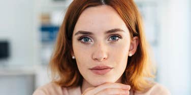 pensive concerned woman thinking about money