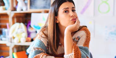 Woman realizing job will be replaced by AI. 