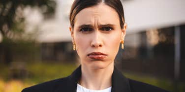 woman looking defensive and angry