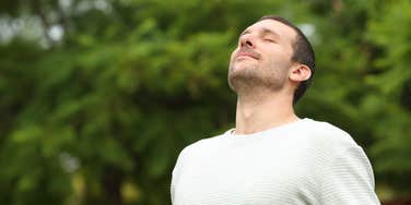 man happy being off of smartphone
