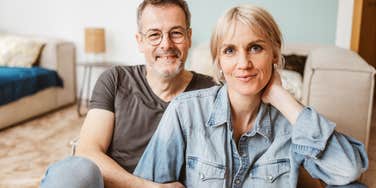 man in love with his wife holding her close
