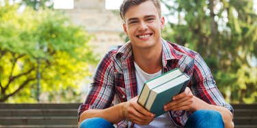 Young man getting his PhD in Happiness
