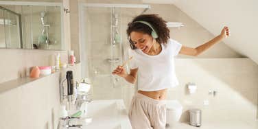 woman dancing showing personality in bathroom
