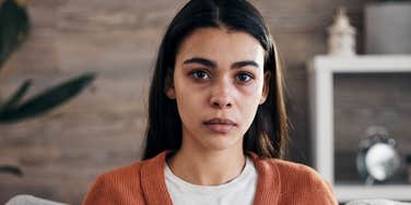 miserable woman not wanting to admit her sadness