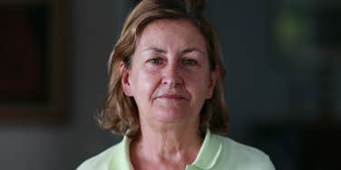 older woman serious about not tolerating anyone's nonsense
