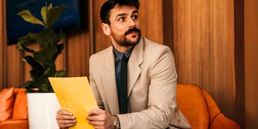 Man waiting for a interview with a sketchy company. 
