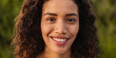 highly intelligent woman smiling refusing to follow social rules