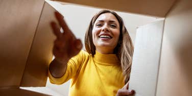 frugal woman looking in box for something she saved