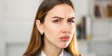 woman annoyed by others bad manners
