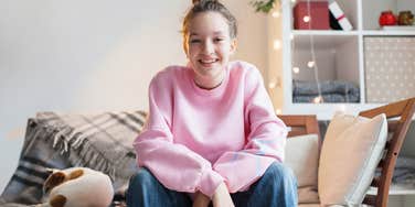 young woman happy in her living room