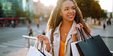 working class woman overspending on shopping spree