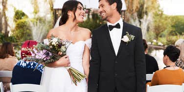 bride and groom smiling at each other