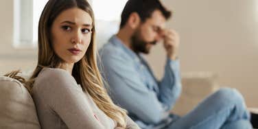 woman who has fallen out of love with her husband turned away from him