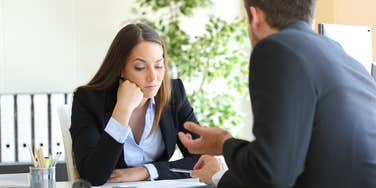 woman getting laughed at in interview
