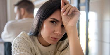 deeply unhappy wife turned away from husband