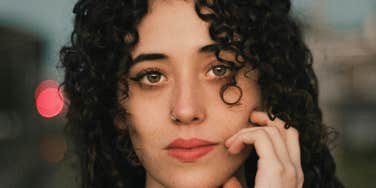 Woman breaking free from Gen-Z dead-eye stare.