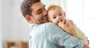 dad holding baby