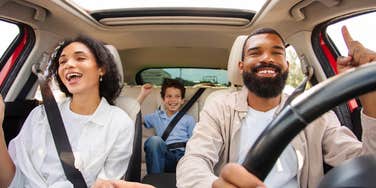 Family listening to music in the car.