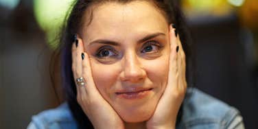 Woman realizing she needs time alone to recharge after small talk. 