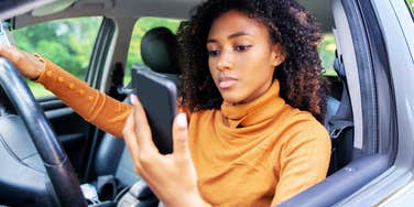 Person distracted on their phone. 