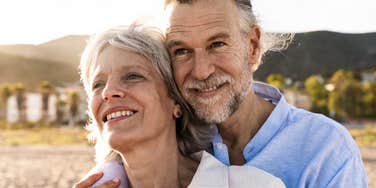 older couple deeply in love with man holding his wife