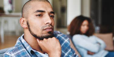 man with a broken heart turned away from wife