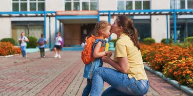 mom dropping her daughter off at elementary school