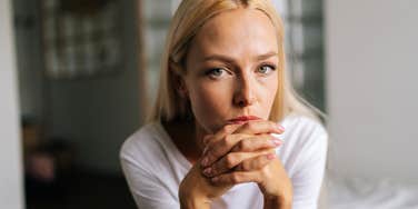 sad woman self-sabotaging her life