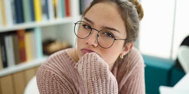 lazy worker sitting in an office looking annoyed