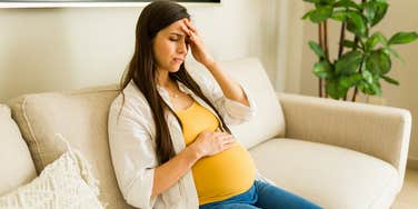 pregnant woman stressed about finances