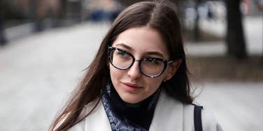 Woman who is looking at a specific body part to determine how smart someone is