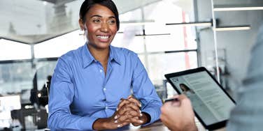job candidate sitting in front of hiring manager during job interview