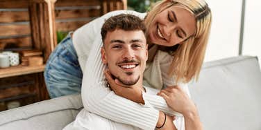 youngest child being hugged by partner