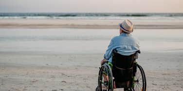 tourist at the beach using a wheelchair