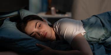 woman waking up middle night meaning