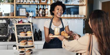 woman ordering coffee from cashier