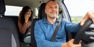 woman sitting in backseat of lyft
