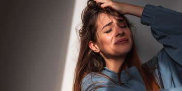 gen z woman sobs student loan interest rate