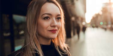 happy woman thinking about her good life