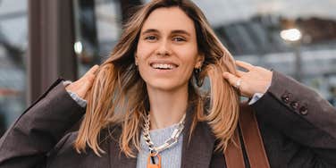 smiling intelligent woman hiding her inner thoughts
